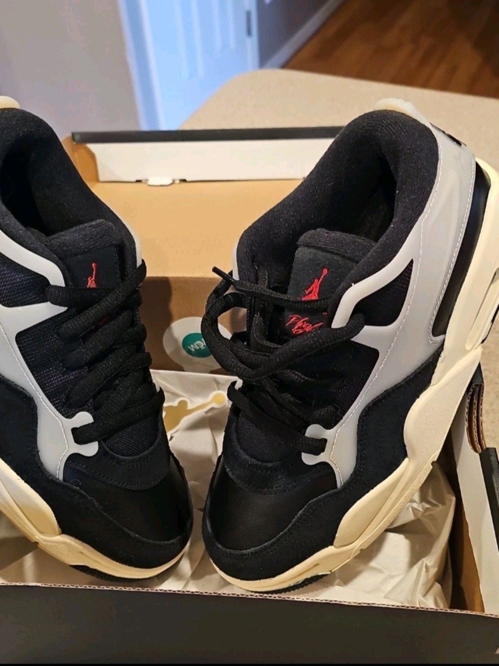 Nike Kids Black and White Sneakers with Red Logo Accent